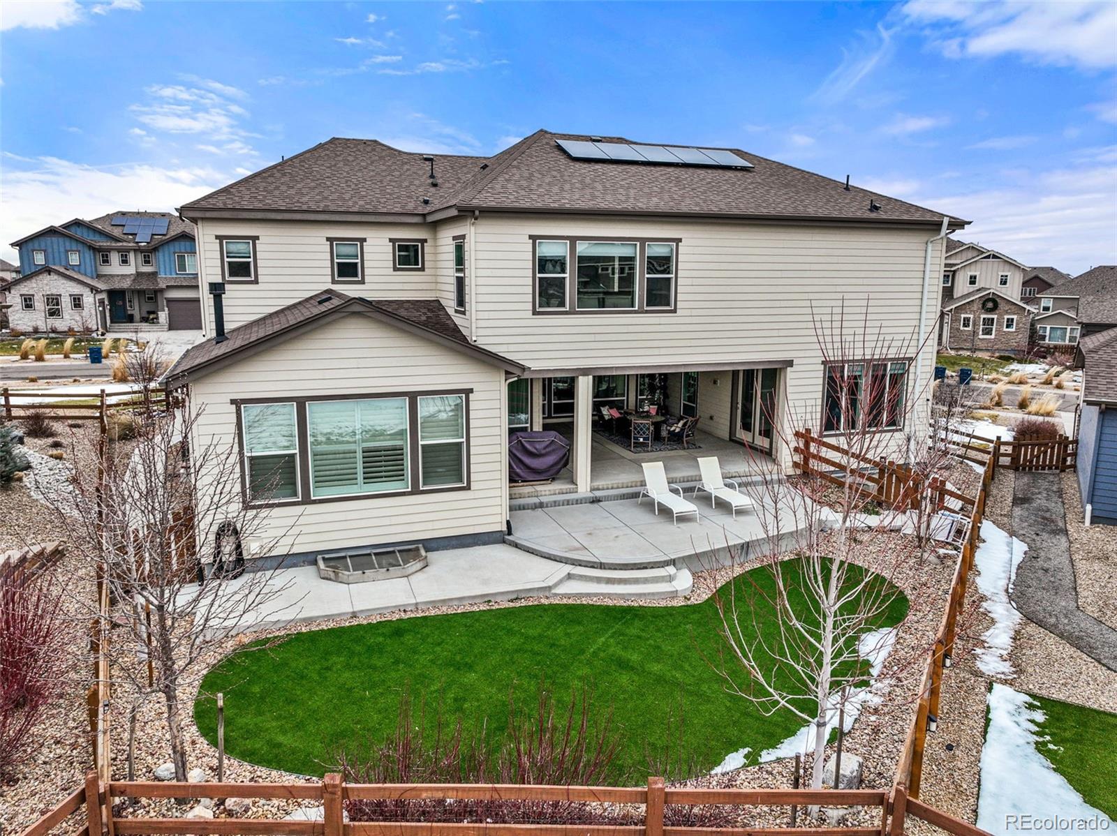 9459 Gore Loop Arvada, CO 80007 - Photo 49 of 50 a view of house with a yard