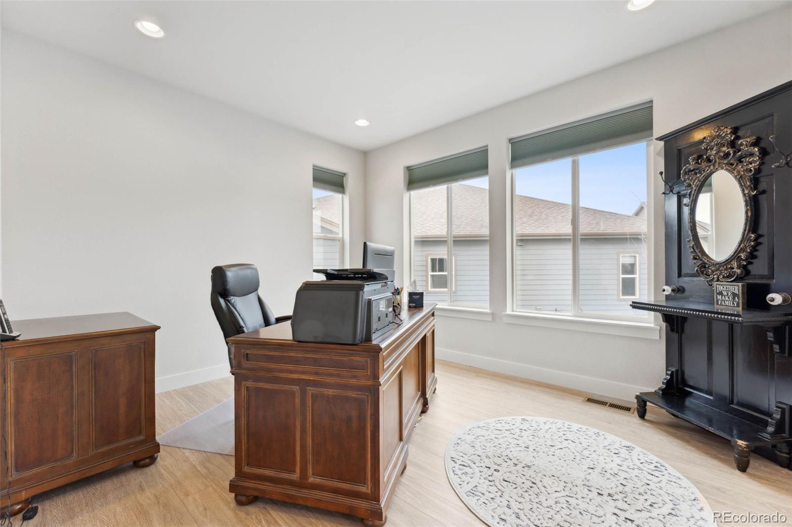 9459 Gore Loop Arvada, CO 80007 - Photo 9 of 50 a work room with furniture and a rug