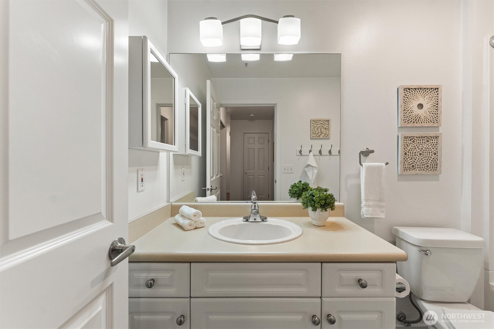 15150 140th Way Southeast, Unit S103 Renton, WA 98058 - Photo 18 of 40 a bathroom with a sink and a mirror