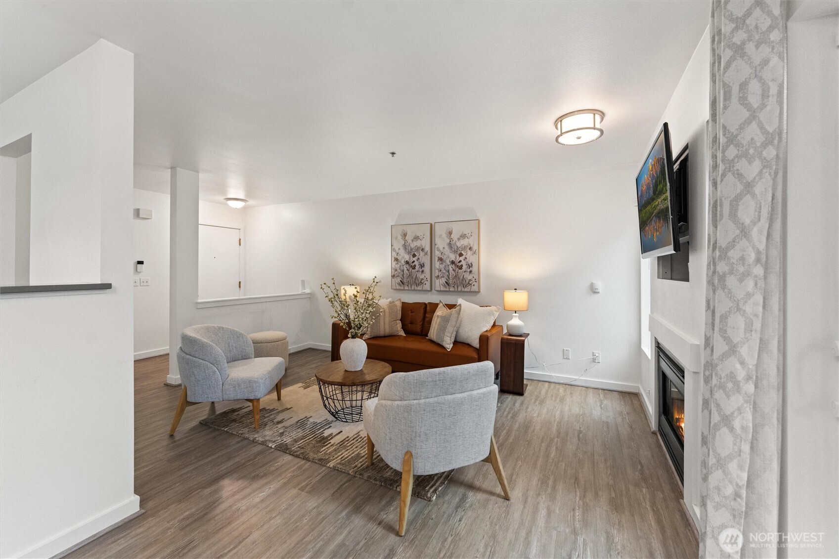 15150 140th Way Southeast, Unit S103 Renton, WA 98058 - Photo 2 of 40 a living room with furniture and a fireplace