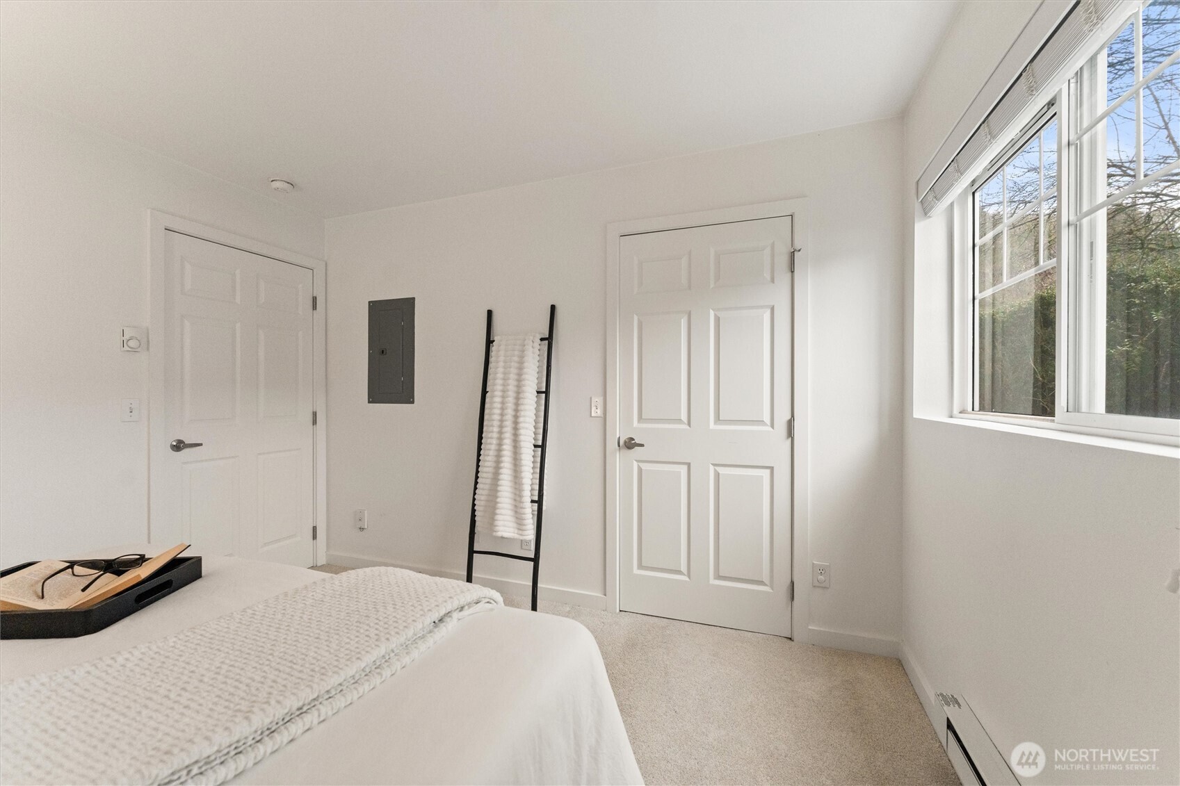 15150 140th Way Southeast, Unit S103 Renton, WA 98058 - Photo 21 of 40 a bedroom with a bed and a closet