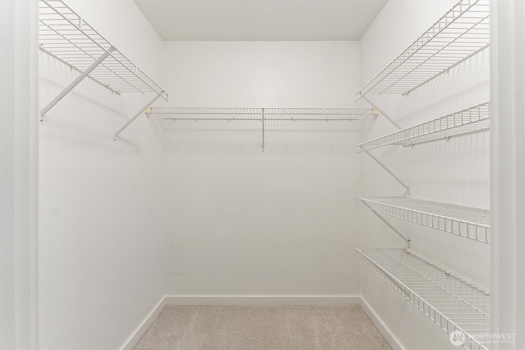 15150 140th Way Southeast, Unit S103 Renton, WA 98058 - Photo 23 of 40 a view of a room with racks on the wall