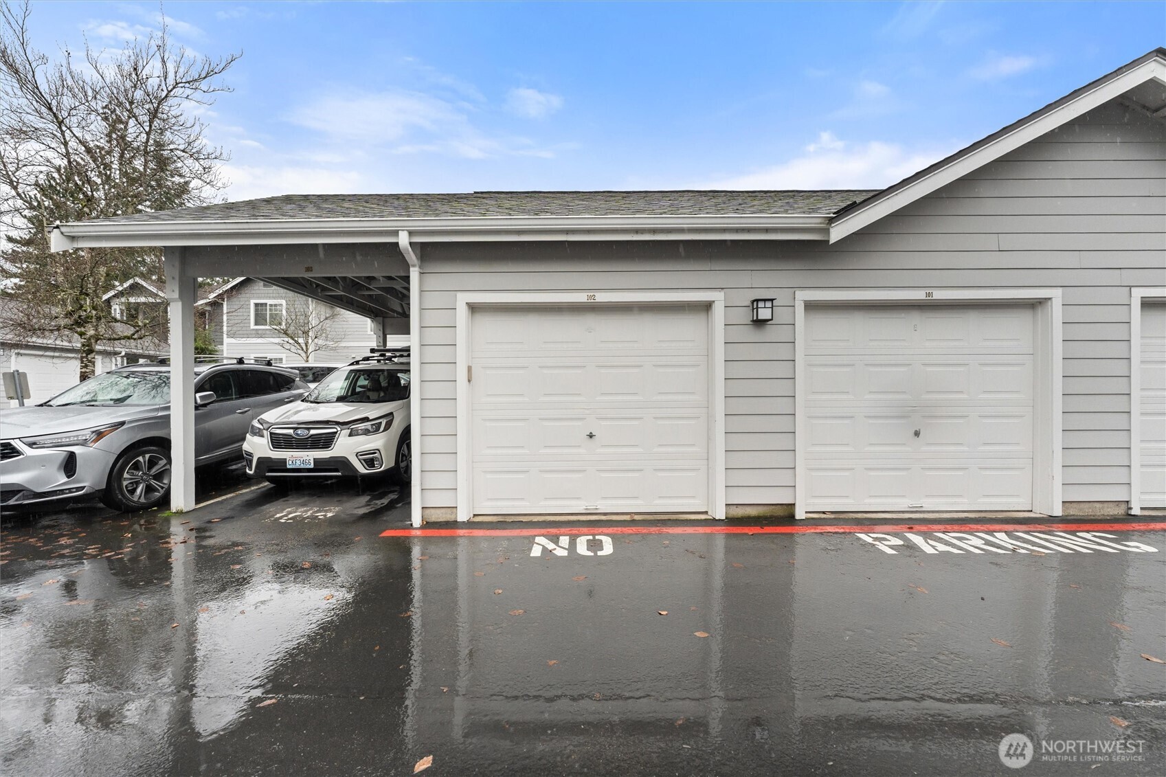 15150 140th Way Southeast, Unit S103 Renton, WA 98058 - Photo 29 of 40 a view of a car parked in front of a house