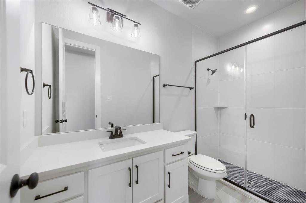 799 Mandrake Road Haslet, TX 76052 - Photo 22 of 27 a bathroom with a sink a toilet and shower