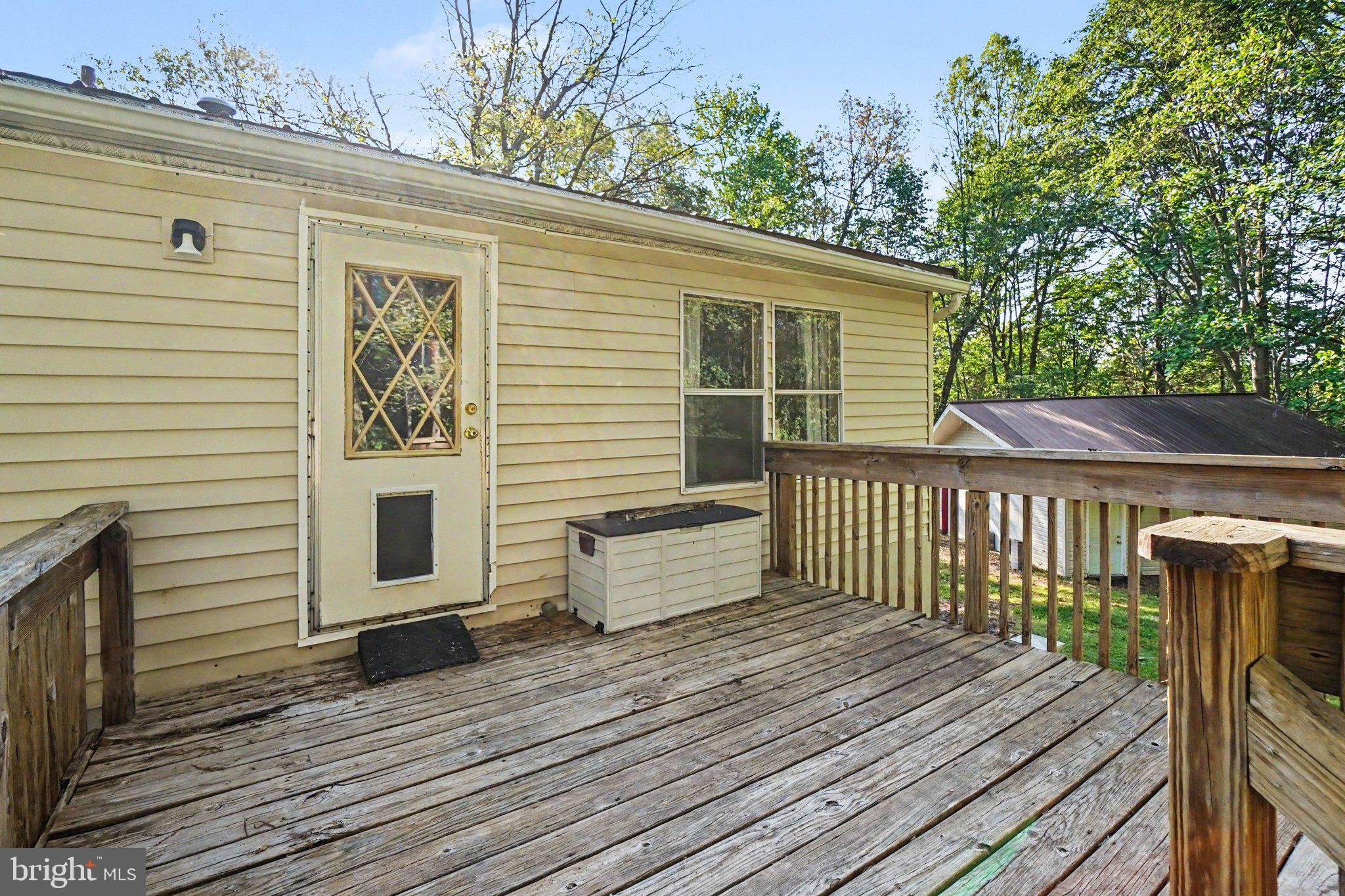 46 Pisgah Rest Shermans Dale, PA 17090 - Photo 26 of 36 a view of a deck with wooden floor and fence next to a yard