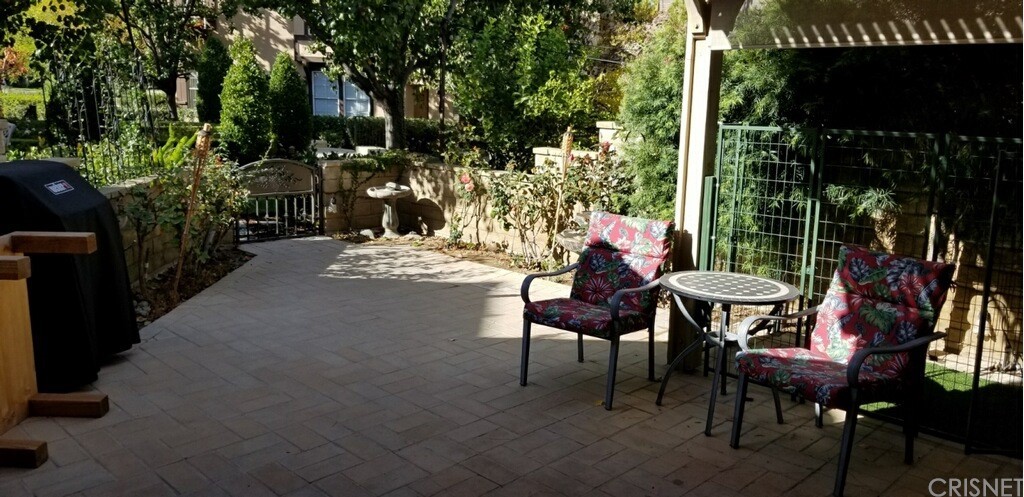 a view of a tables and chairs in patio