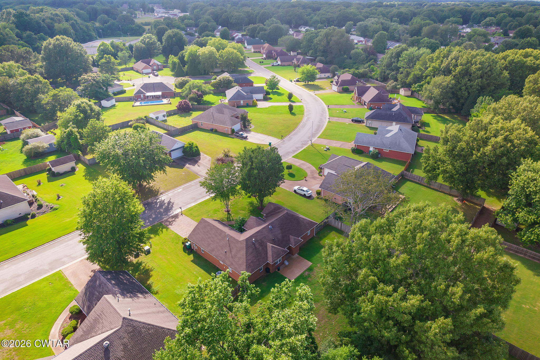 96 Sundown Drive Jackson, TN 38305 - Photo 25 of 28 a aerial view of a house with a swimming pool yard and outdoor seating
