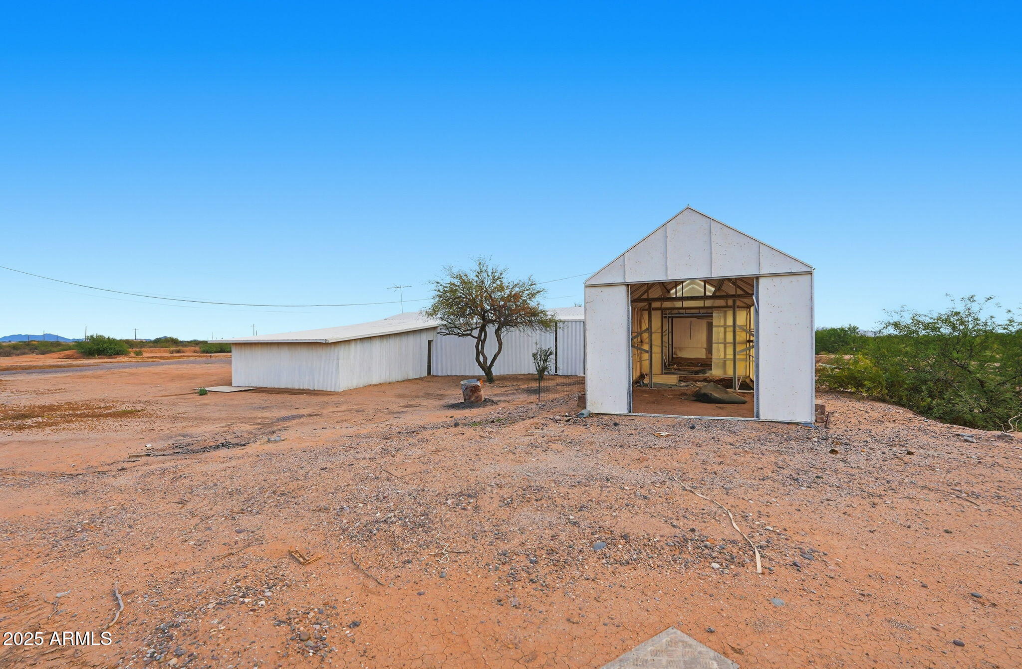 9156 South Thornton Road Casa Grande, AZ 85193 - Photo 20 of 24 a front view of a house with a yard