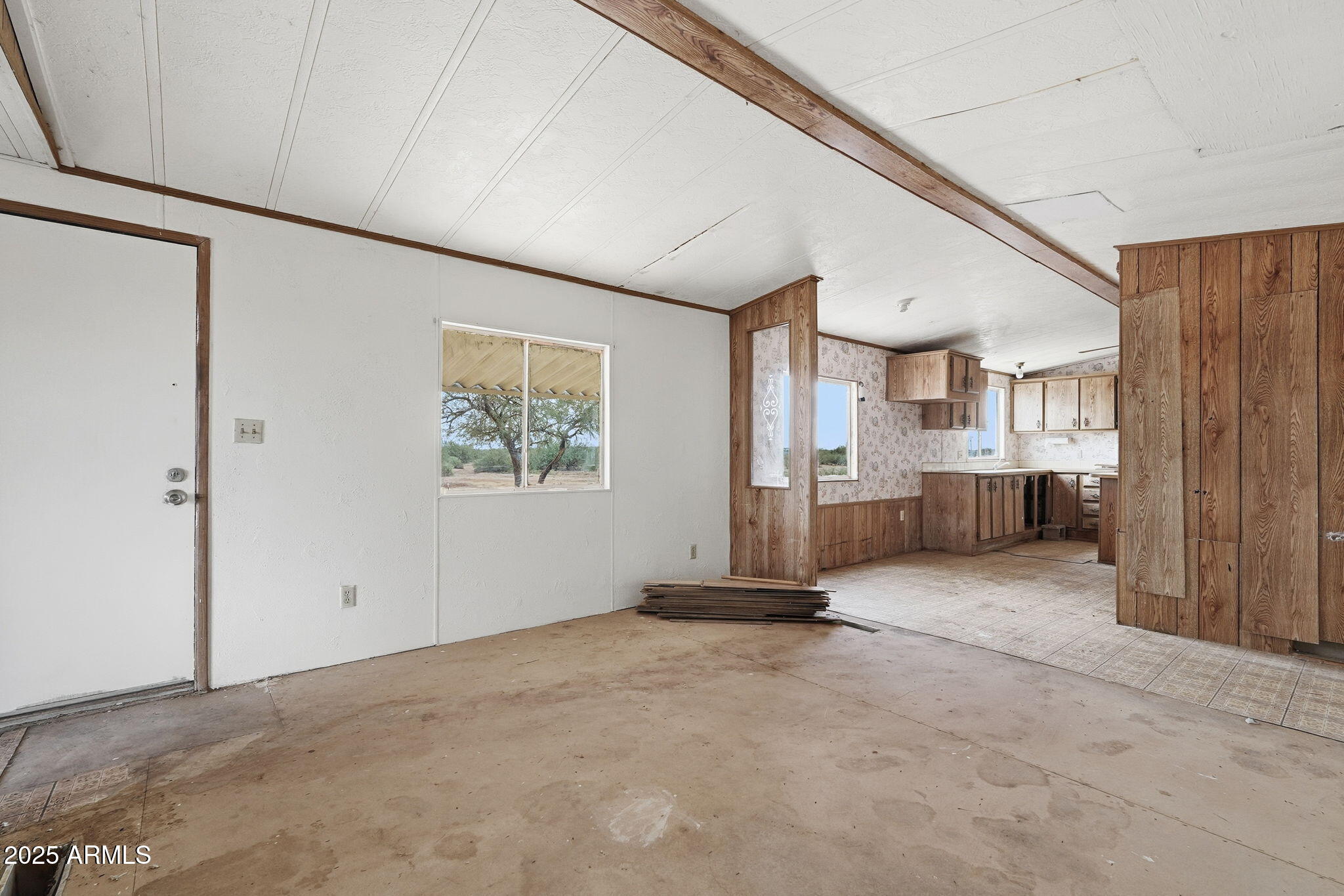 9156 South Thornton Road Casa Grande, AZ 85193 - Photo 5 of 24 a view of a kitchen with furniture and a window