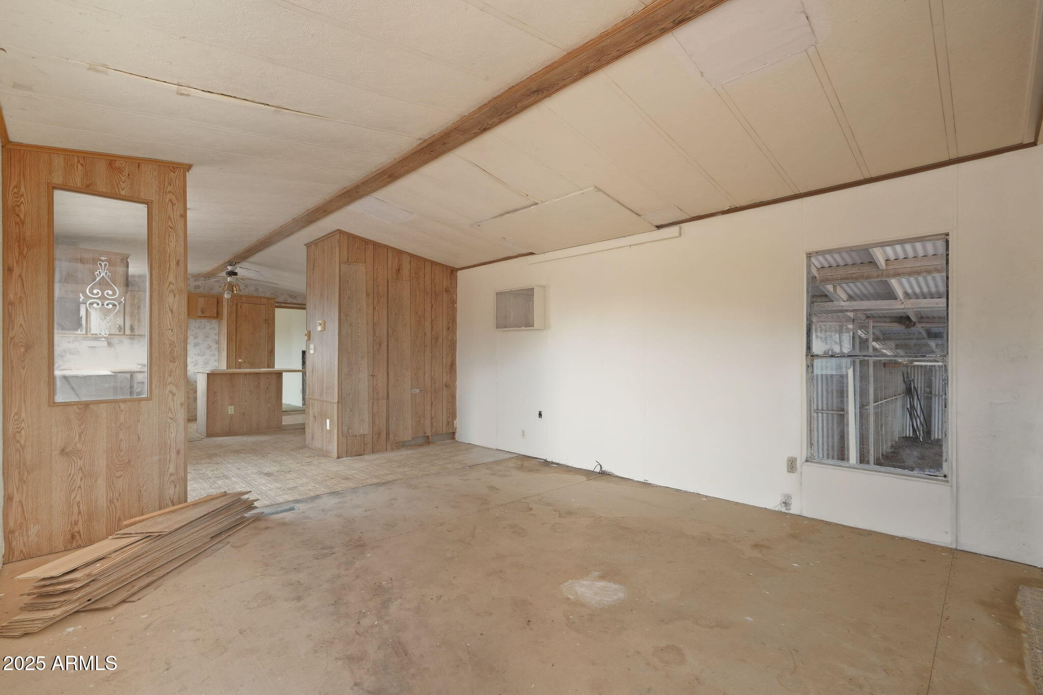 9156 South Thornton Road Casa Grande, AZ 85193 - Photo 6 of 24 a view of livingroom with an empty space and kitchen view