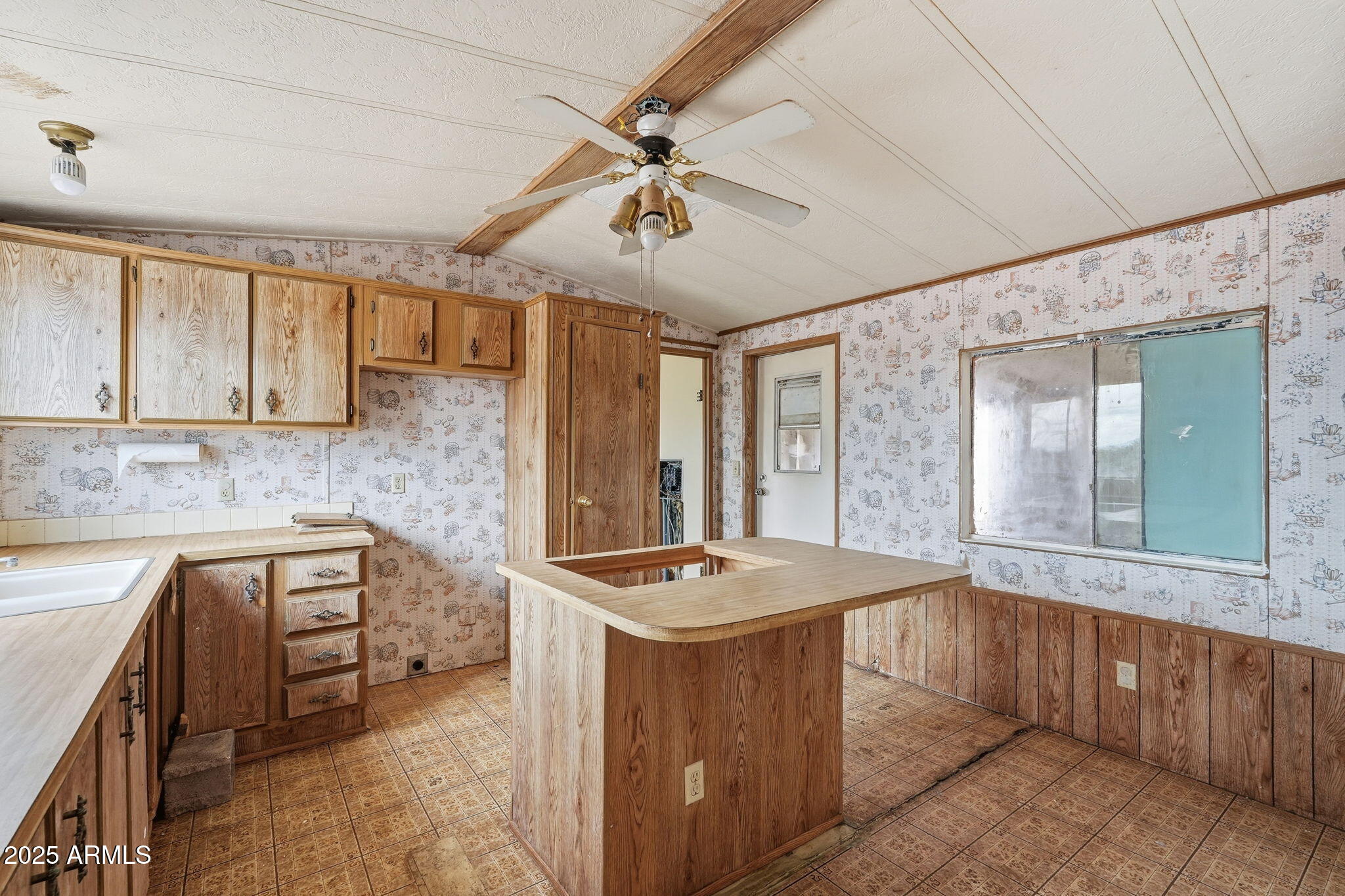9156 South Thornton Road Casa Grande, AZ 85193 - Photo 7 of 24 a room with sink cabinets and window