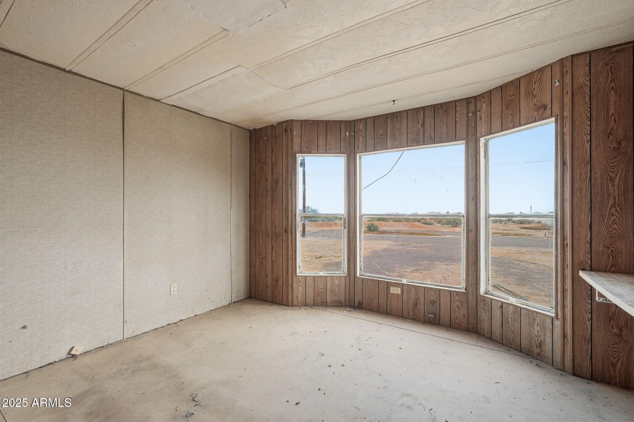 9156 South Thornton Road Casa Grande, AZ 85193 - Photo 10 of 24 a view of an empty room with a window