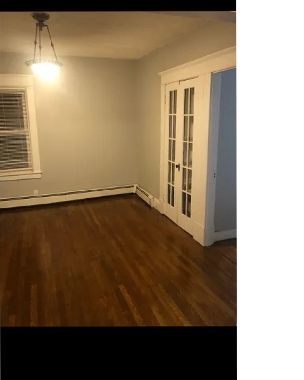 116 Middlesex Street, Unit 2 Springfield, MA 01109 - Photo 3 of 4 a view of an empty room with wooden floor and a window