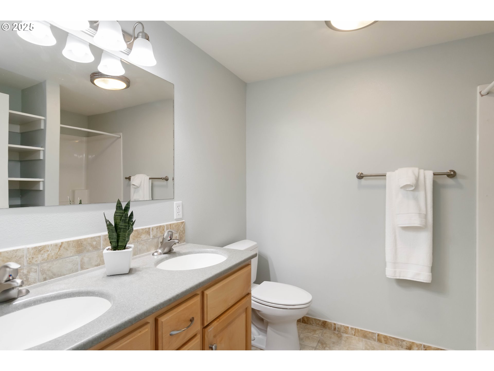 1548 River Road, Unit 302 Longview, WA 98632 - Photo 20 of 42 a bathroom with a granite countertop sink vanity mirror and toilet
