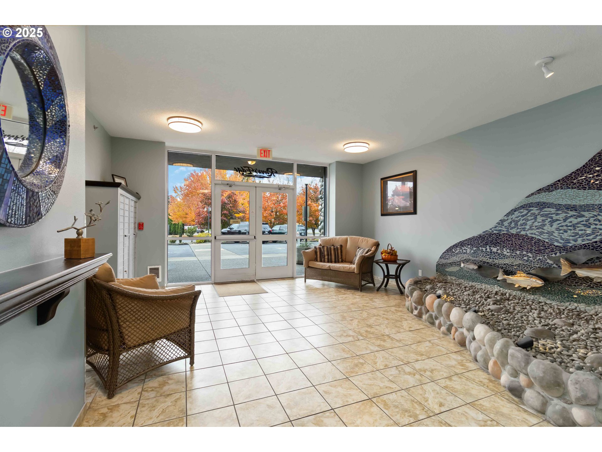 1548 River Road, Unit 302 Longview, WA 98632 - Photo 31 of 42 a living room with furniture a rug and a flat screen tv