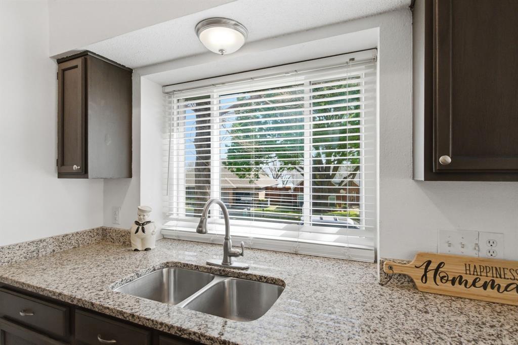 7801 Defender Lane Rowlett, TX 75089 - Photo 19 of 35 Kitchen window with a peek a boo view of Lake Ray Hubbard
