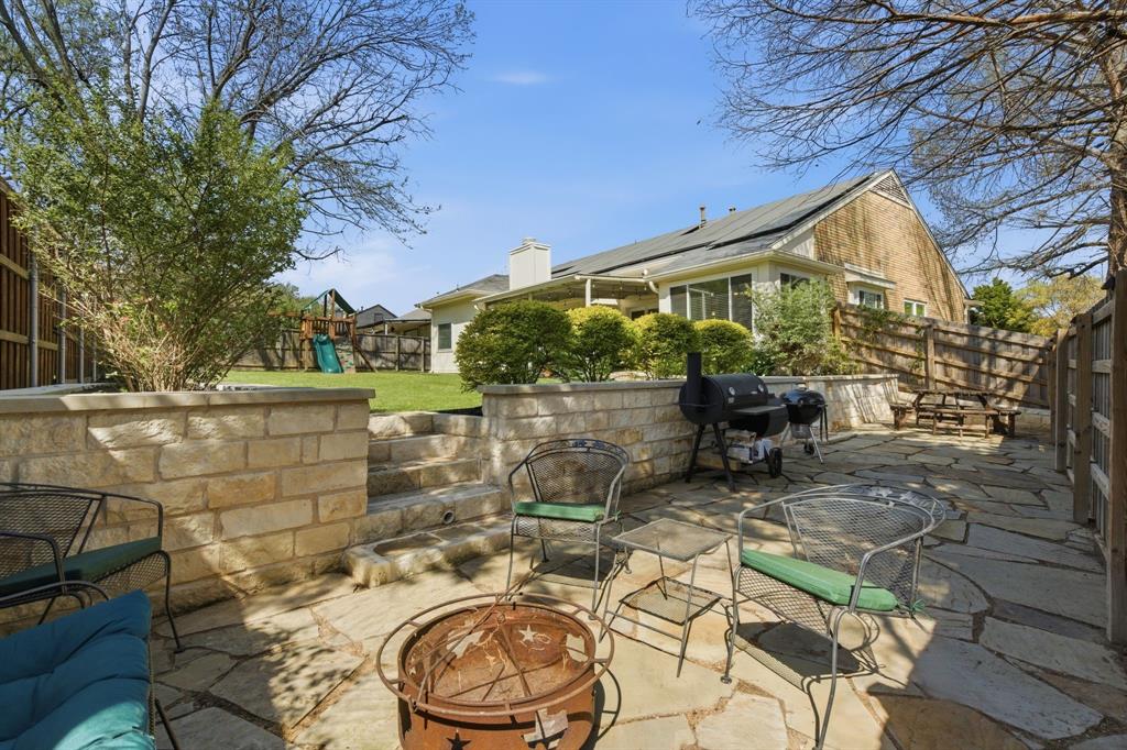 7801 Defender Lane Rowlett, TX 75089 - Photo 27 of 35 Great BBQ area with added retaining wall and flower beds