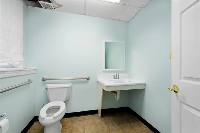 a view of a hallway with wooden shelves