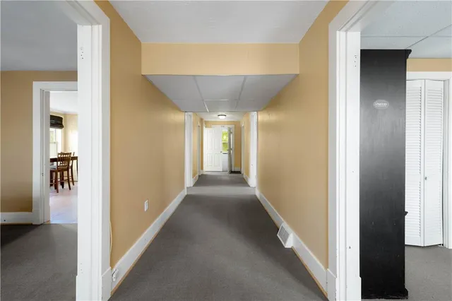 a view of a dining room with furniture and window