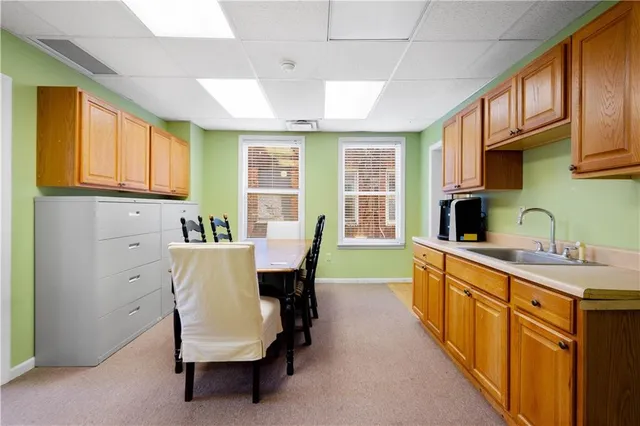 a bedroom with a bed and a chandelier fan