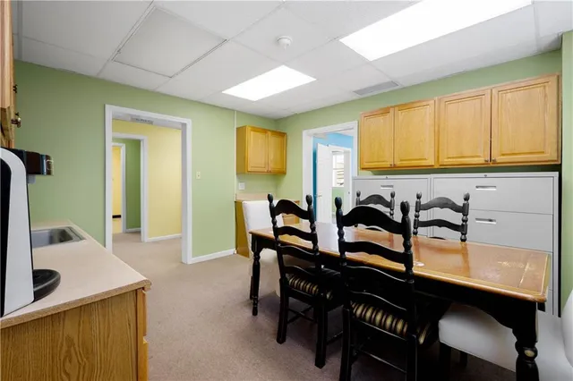 a room with furniture and a dresser