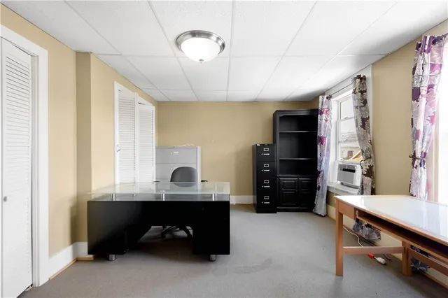 a white toilet sitting next to a bath tub