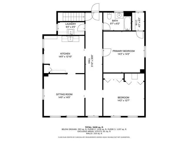 a view of a hallway with wooden walls and stairs