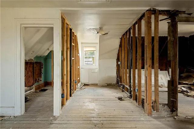 a view of a room with wooden walls