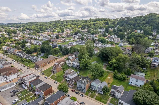 an aerial view of a city with lots of residential buildings