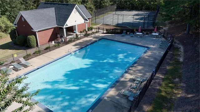 a aerial view of a house with a yard