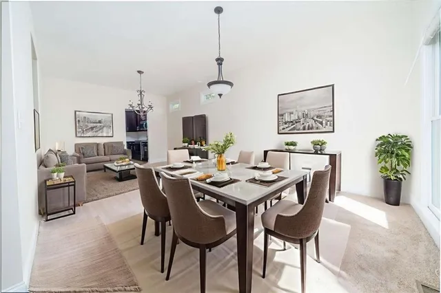 a view of a dining room with furniture