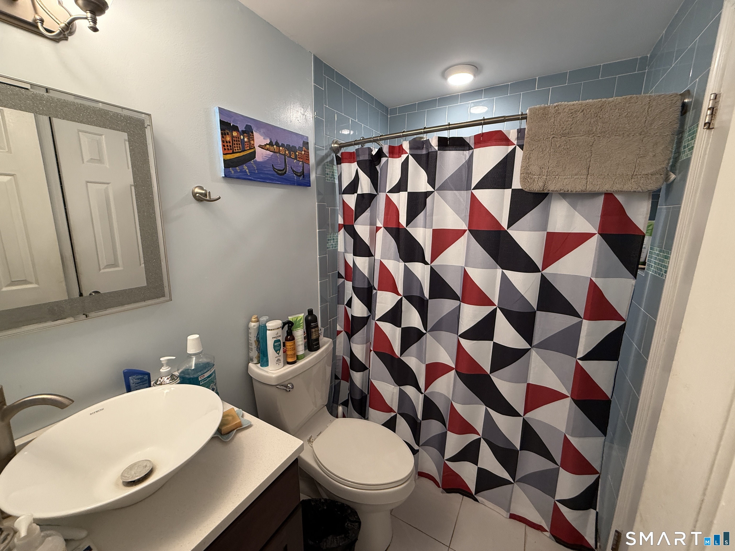 900 Mix Avenue, Unit 68 Hamden, CT 06514 - Photo 13 of 16 a bathroom with a sink toilet and shower