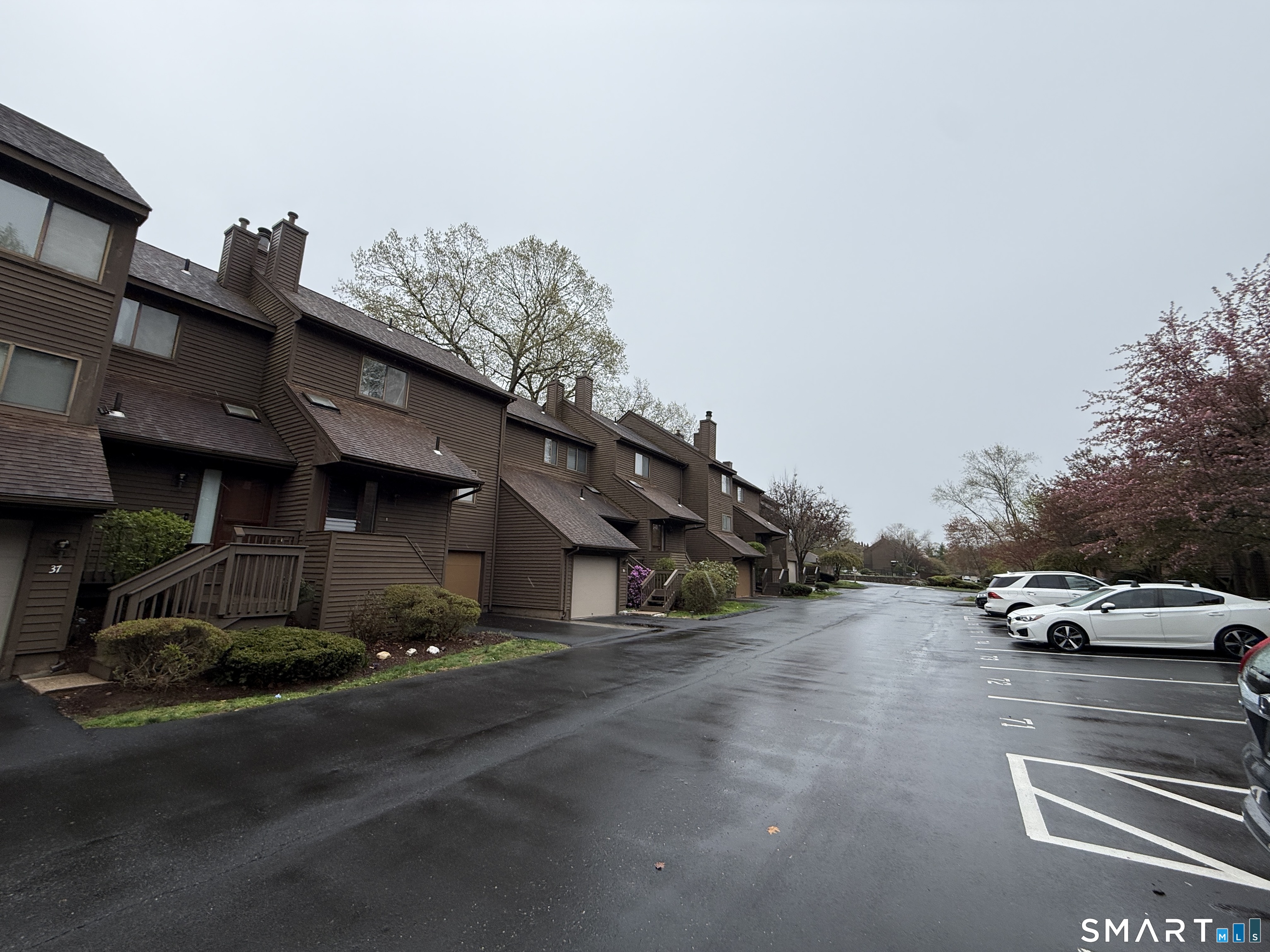 900 Mix Avenue, Unit 68 Hamden, CT 06514 - Photo 2 of 16 a car parked on the side of the road