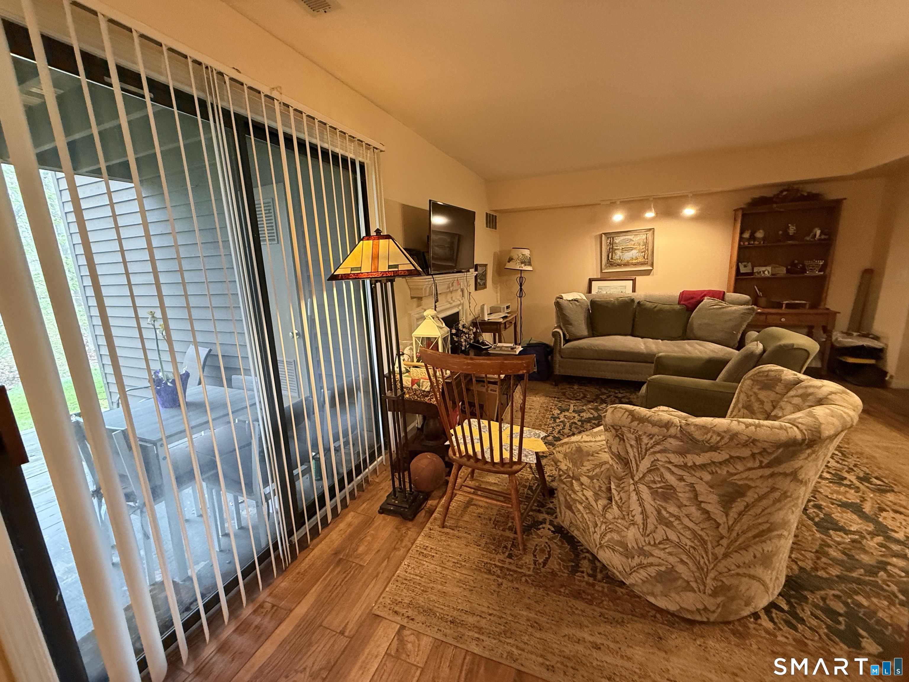900 Mix Avenue, Unit 68 Hamden, CT 06514 - Photo 4 of 16 a living room with furniture floor to ceiling window and stairs