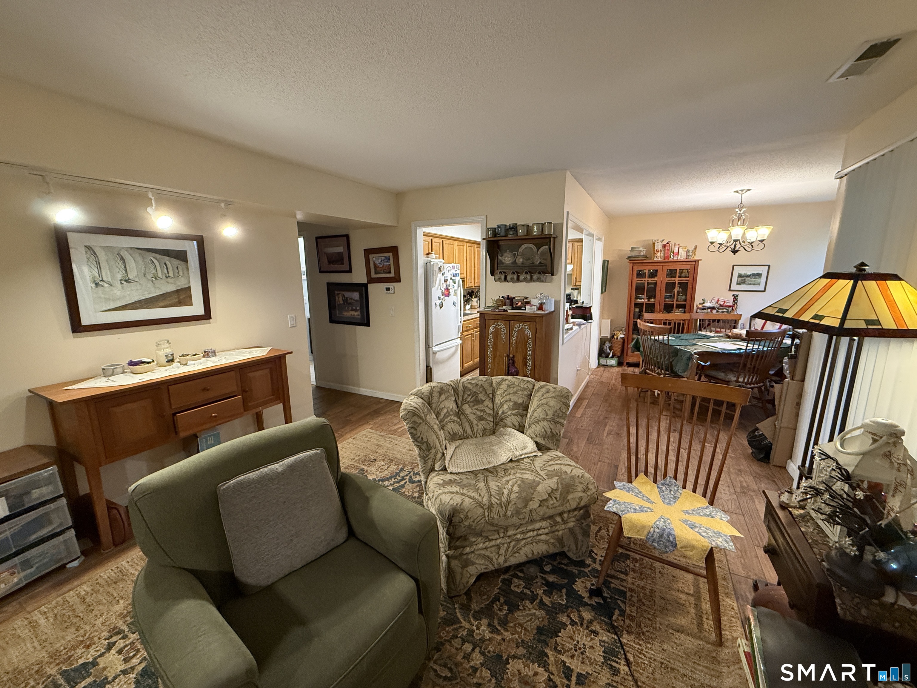 900 Mix Avenue, Unit 68 Hamden, CT 06514 - Photo 5 of 16 a living room with furniture and a flat screen tv