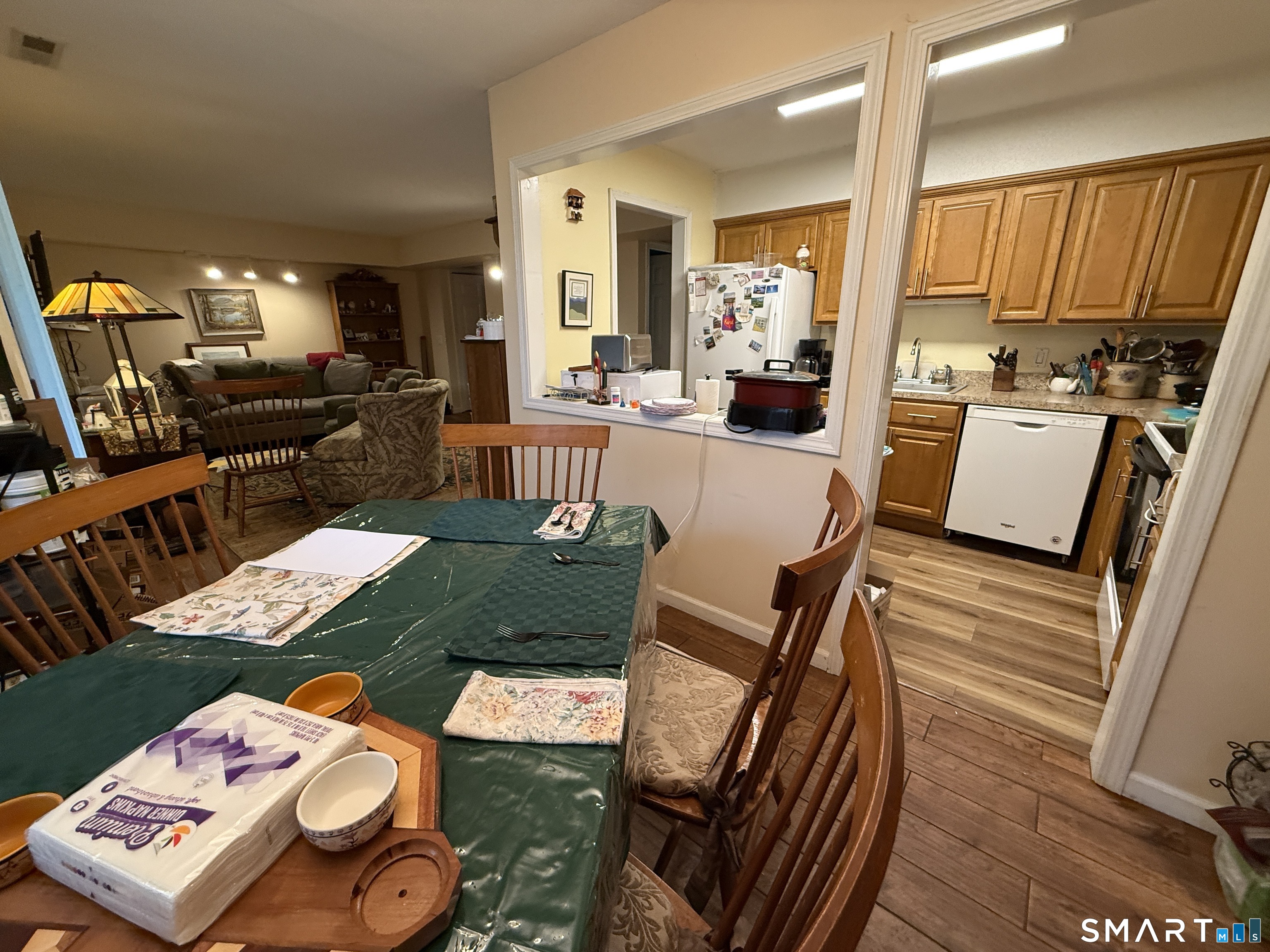 900 Mix Avenue, Unit 68 Hamden, CT 06514 - Photo 7 of 16 a living room with furniture and a wooden floor