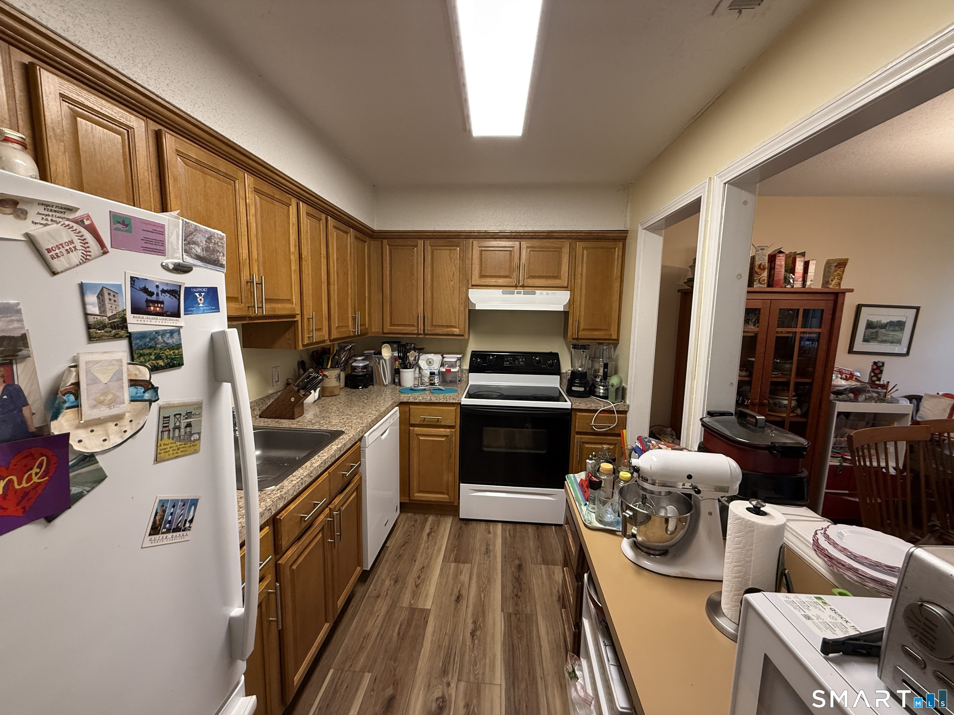 900 Mix Avenue, Unit 68 Hamden, CT 06514 - Photo 8 of 16 a kitchen with a refrigerator stove and sink