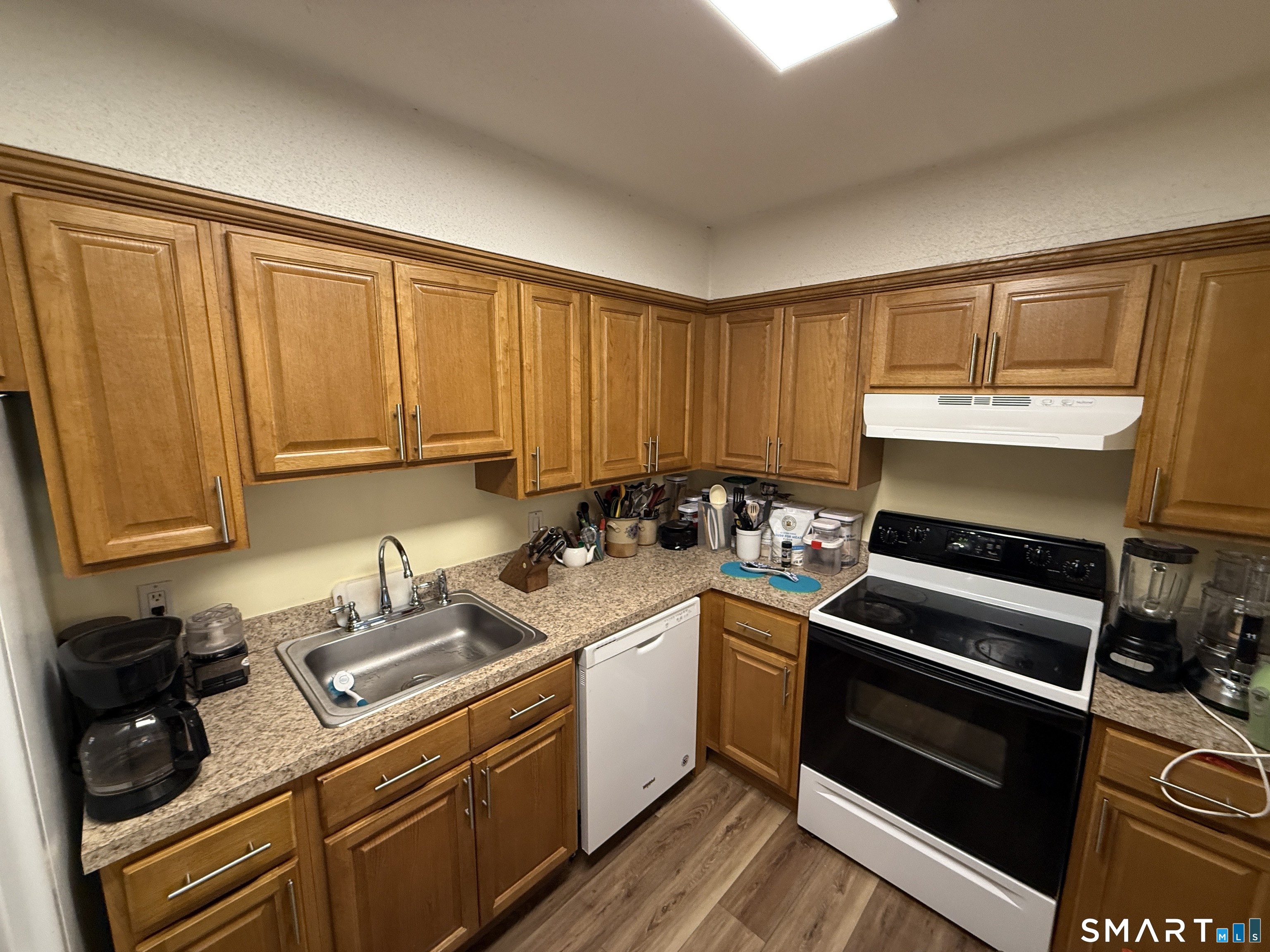900 Mix Avenue, Unit 68 Hamden, CT 06514 - Photo 9 of 16 a kitchen with a stove and a sink