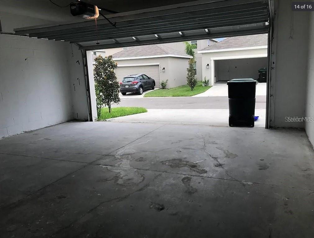 15187 Chapter Way Winter Garden, FL 34787 - Photo 11 of 17 a view of a car garage