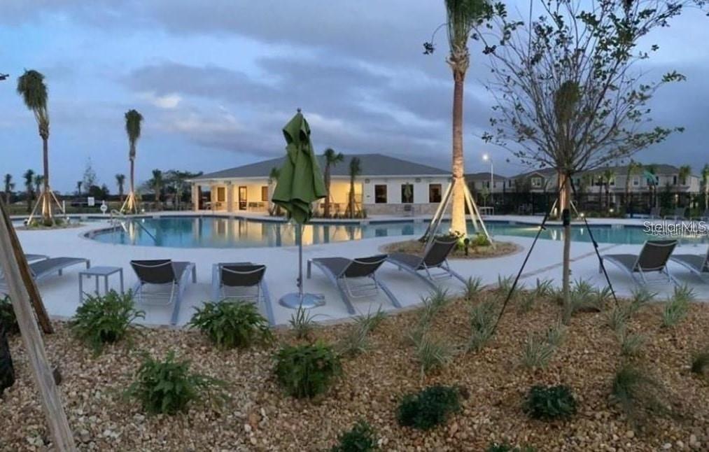 15187 Chapter Way Winter Garden, FL 34787 - Photo 14 of 17 a view of a building with a garden and a tree