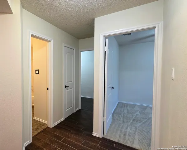 a view of a bathroom from the hallway