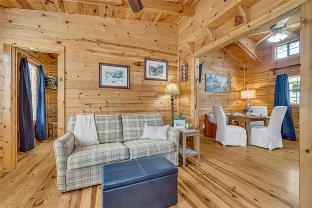 a bed sitting in a bedroom next to a bathroom