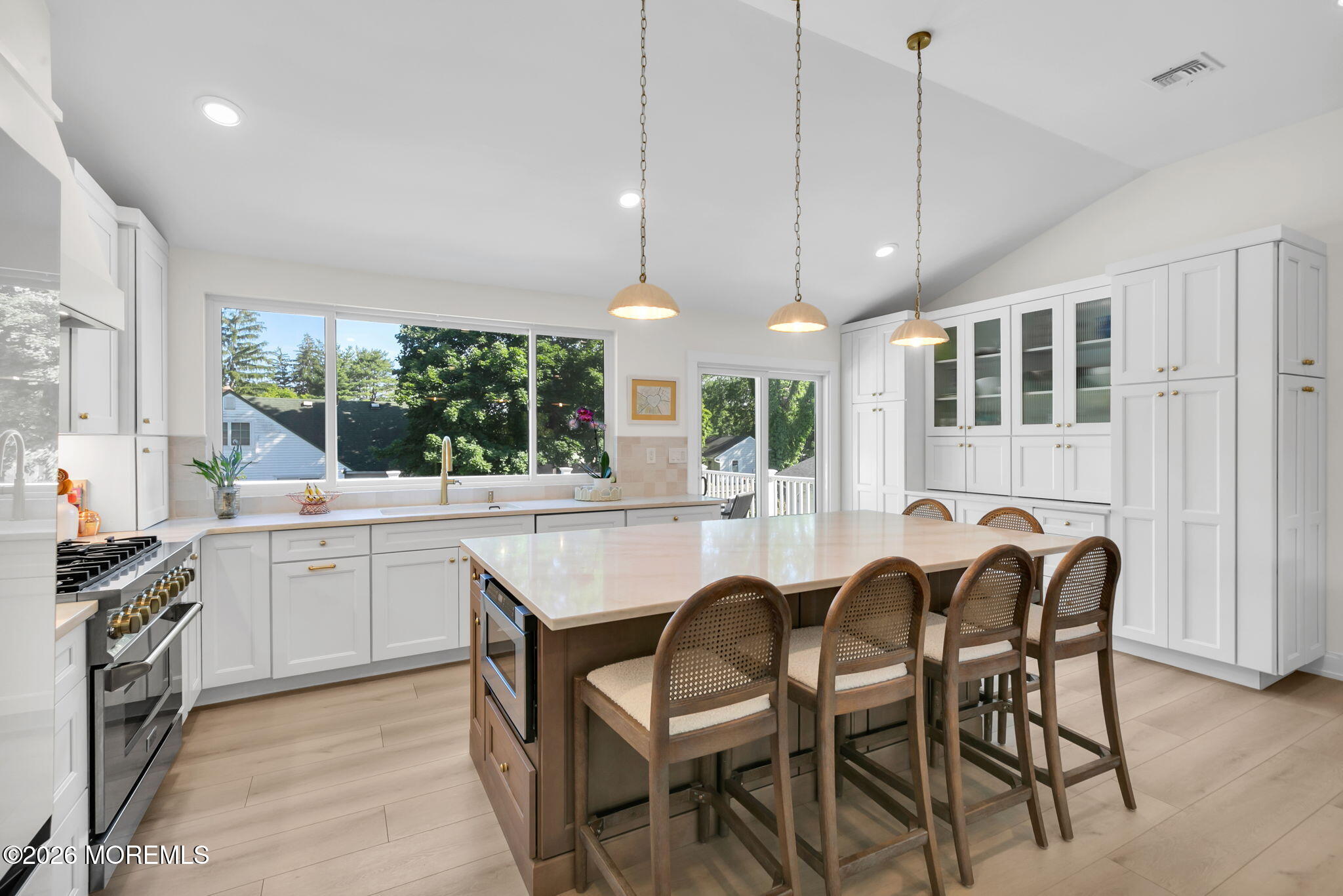 53 Field Avenue Red Bank, NJ 07701 - Photo 4 of 39 a kitchen with granite countertop white cabinets and chairs