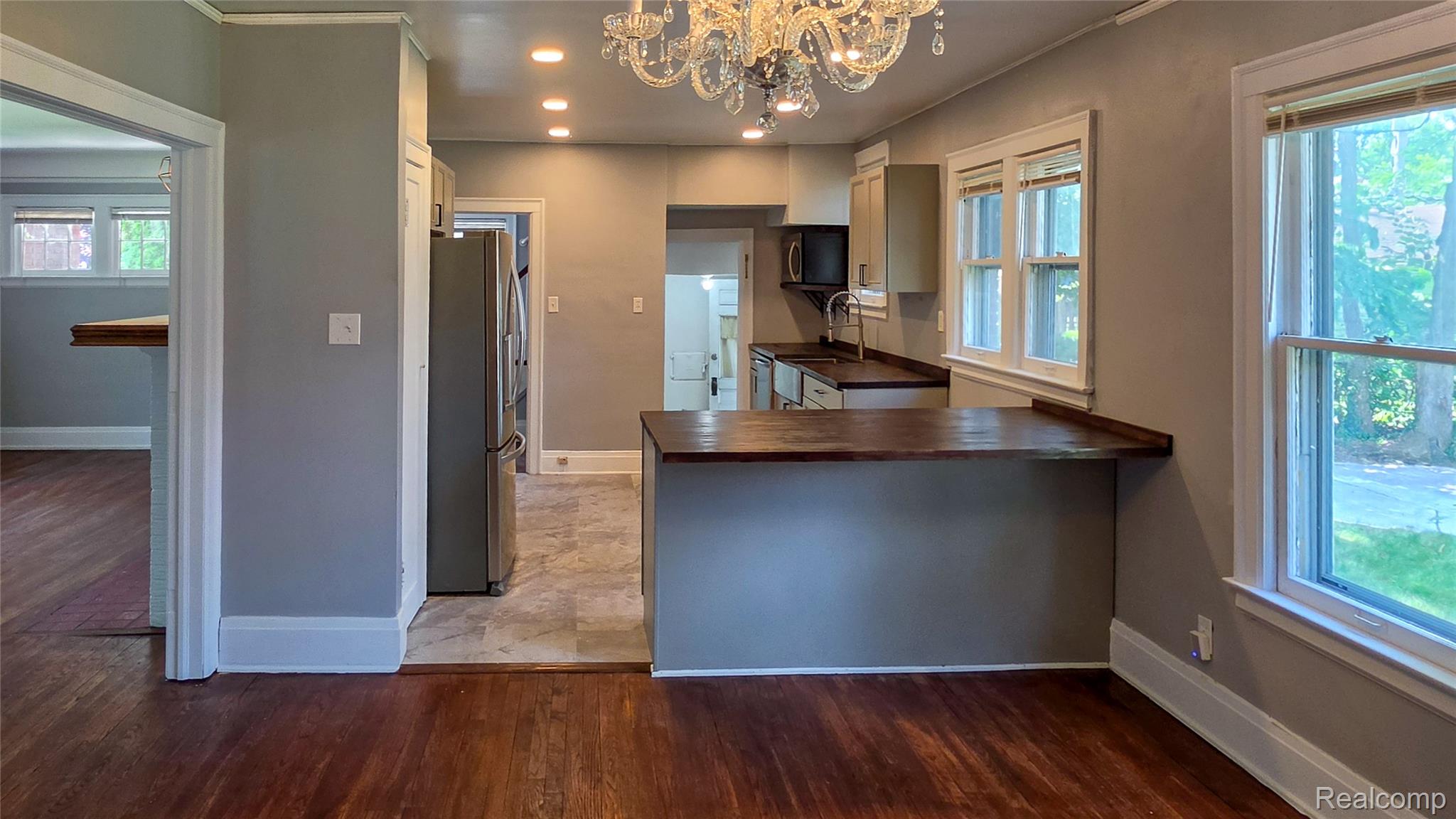 16715 Edinborough Road Detroit, MI 48219 - Photo 7 of 21 Kitchen with wood-finish flooring, recessed lighting, and a crystal chandelier