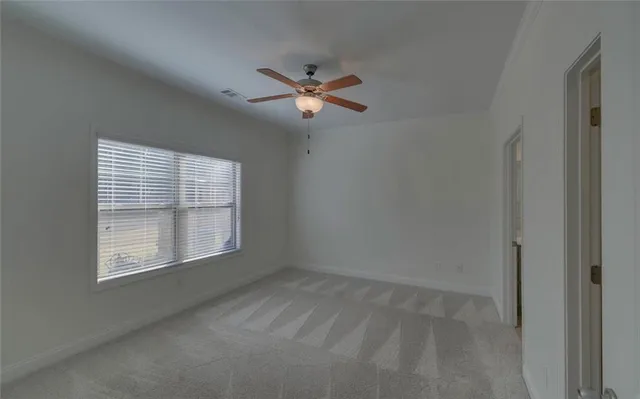 a view of empty room with windows