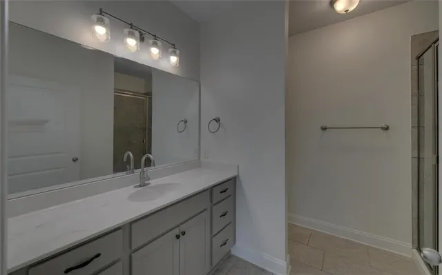 a bathroom with a sink double vanity and a mirror