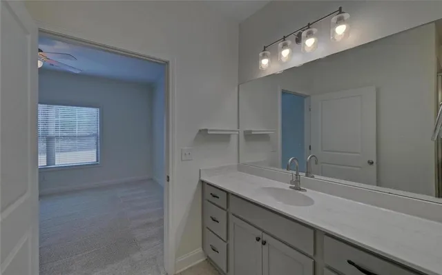 a bathroom with a sink double vanity and a mirror