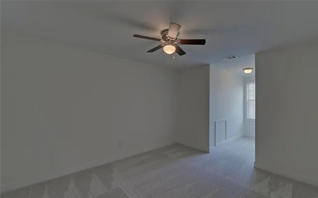 a view of a livingroom with a fan