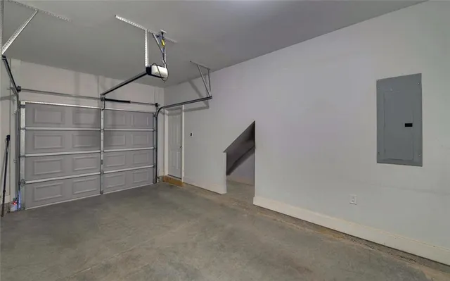 a view of a patio with table and chairs and potted plants