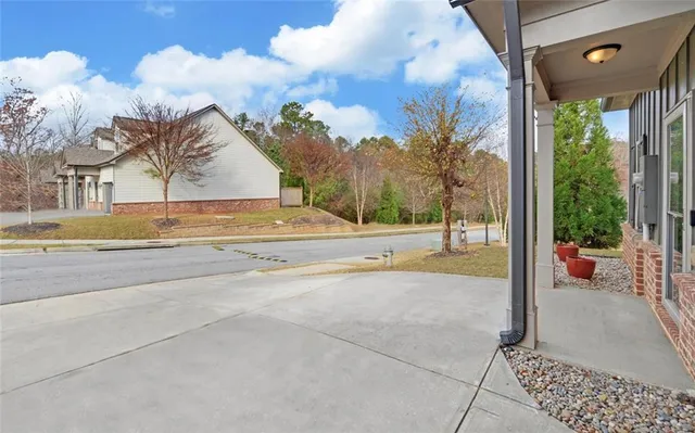a view of a swimming pool with an outdoor seating